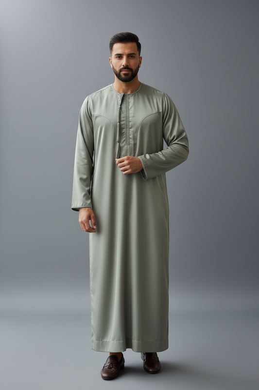 Man wearing a long moss green thobe 