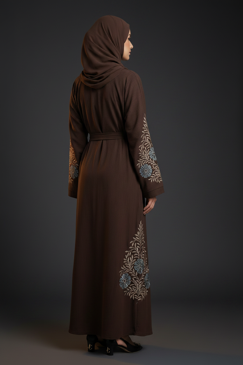 Woman wearing a brown abaya with floral embroidery 