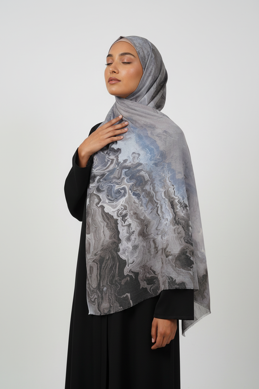 Woman wearing a gray marble-patterned hijab