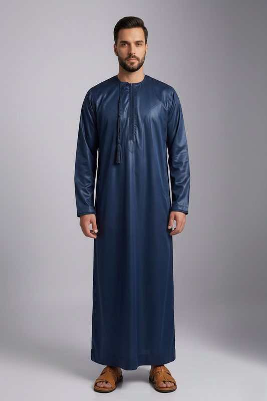 Man wearing a long blue thobe
