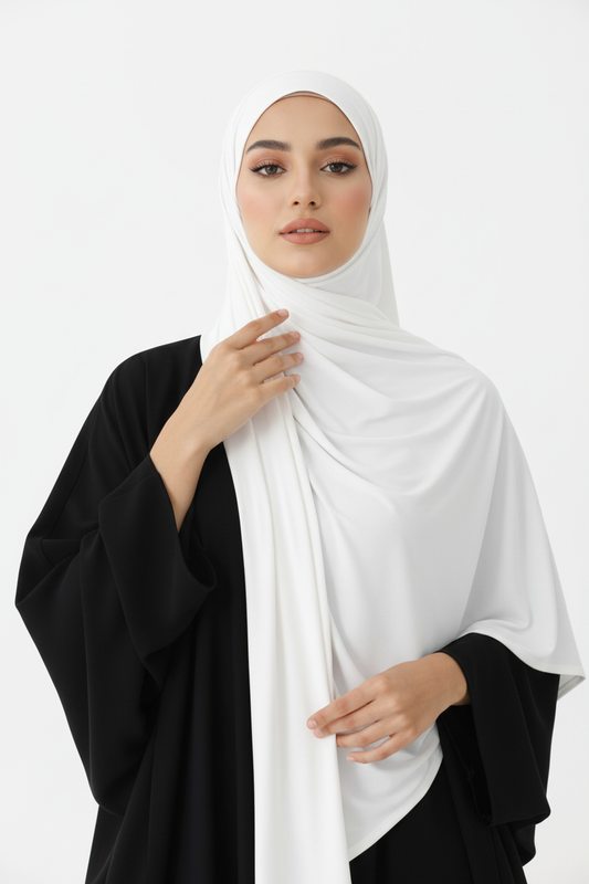 Woman wearing a white hijab and black abaya